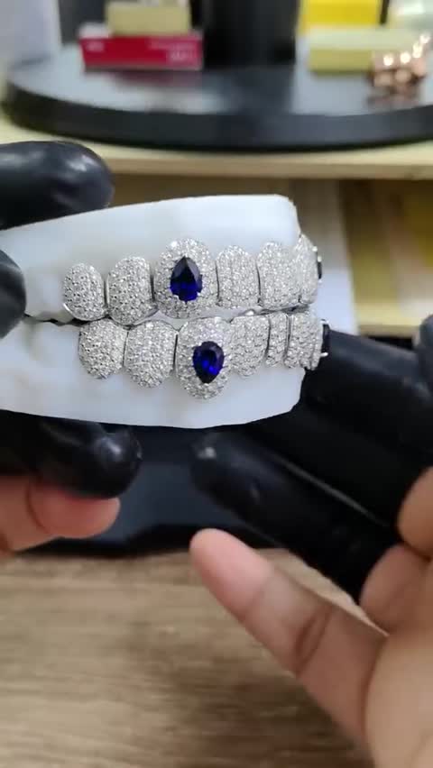 Finished set with sapphire accents, white gold