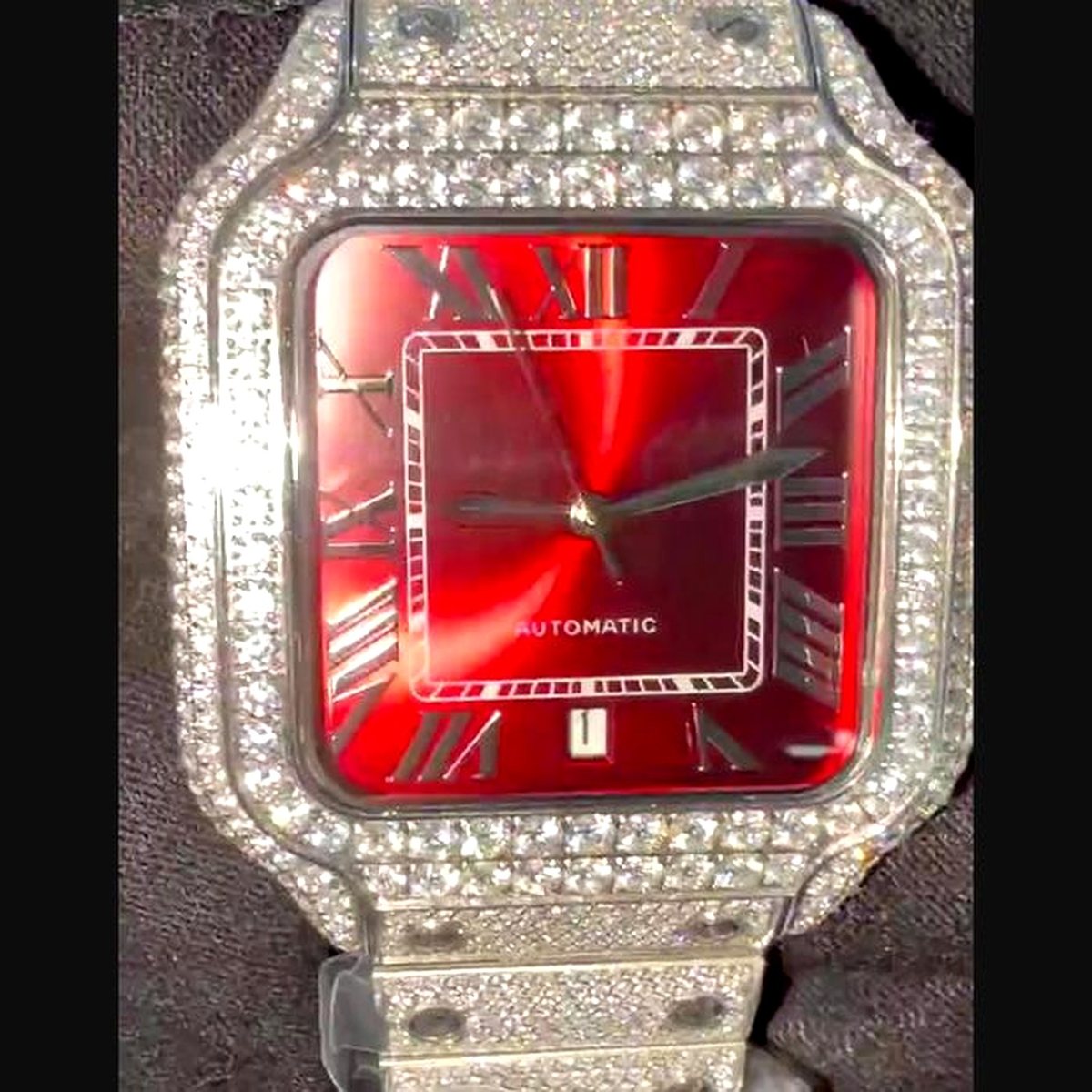 Red sunburst dial, steel case